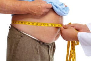 Cure Obstructive Sleep Apnea, 44990370 - doctor measuring obese man waist body fat. obesity and weight loss.
