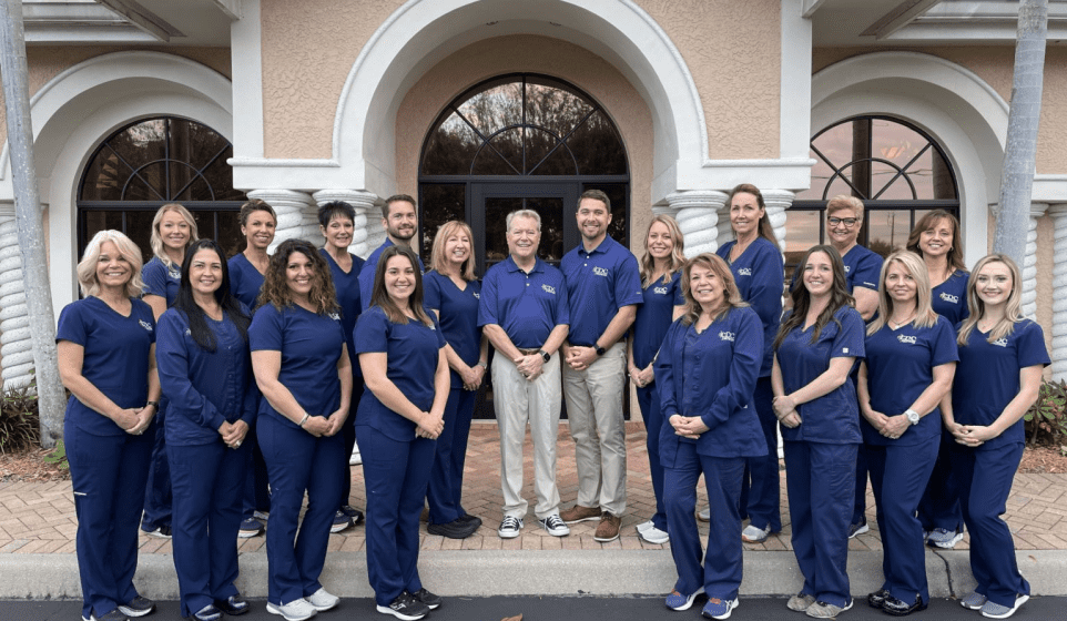Cape Dental Care experienced staff posing in front of the Cape Coral, Florida location