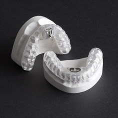 Teeth retainers on white mold displays